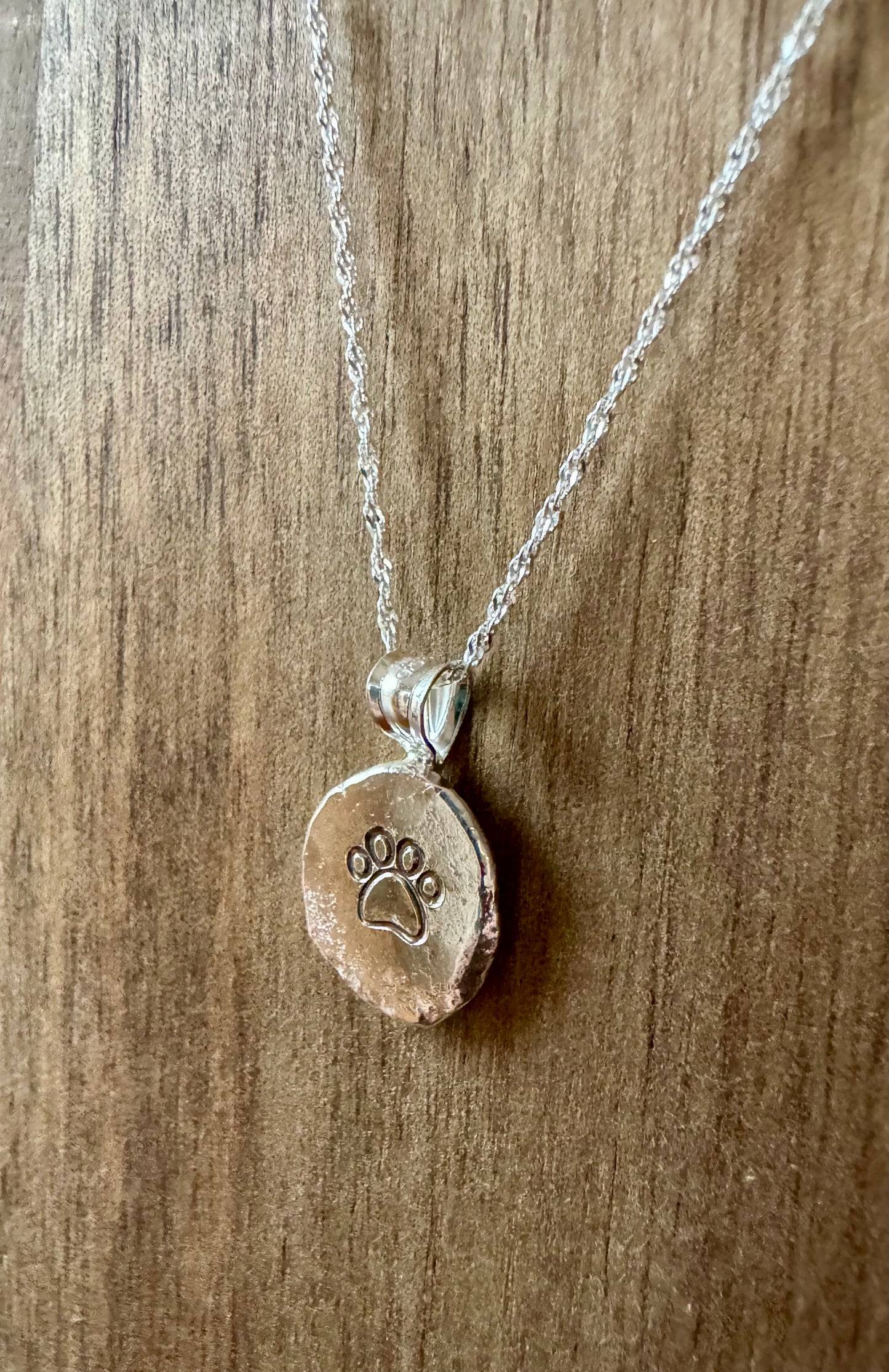 Sterling silver paw print necklace