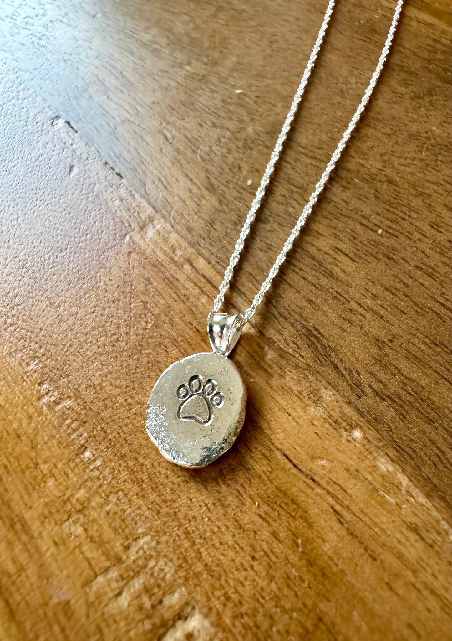 Sterling silver paw print necklace